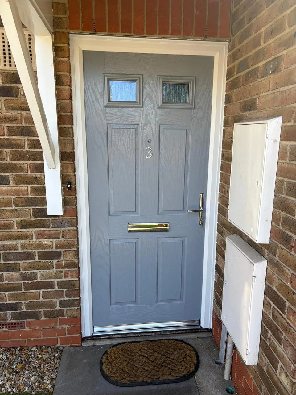 Grey composite entrance door with two glazed panels