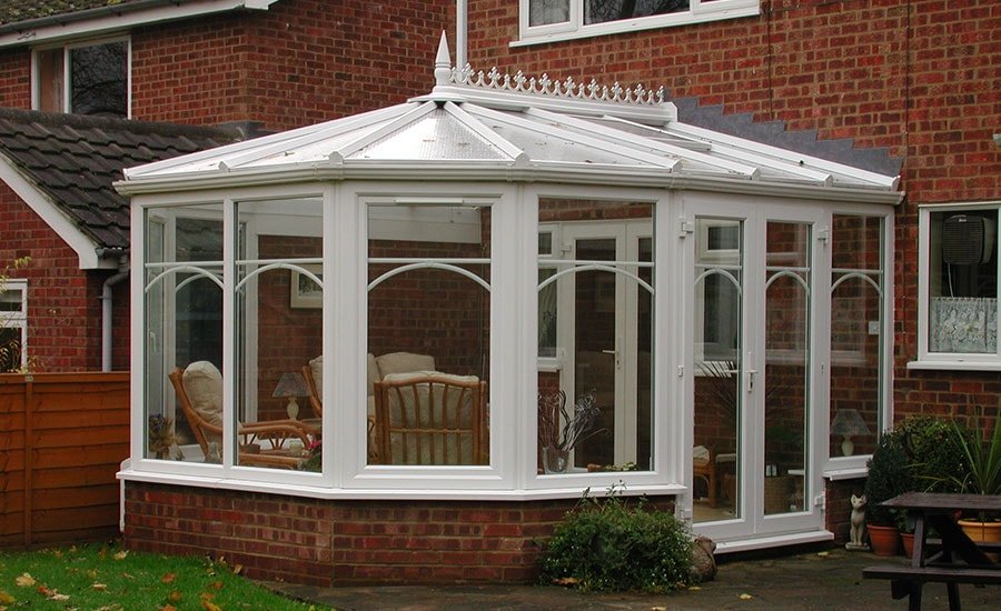 White uPVC Victorian conservatory with ornate roof cresting
