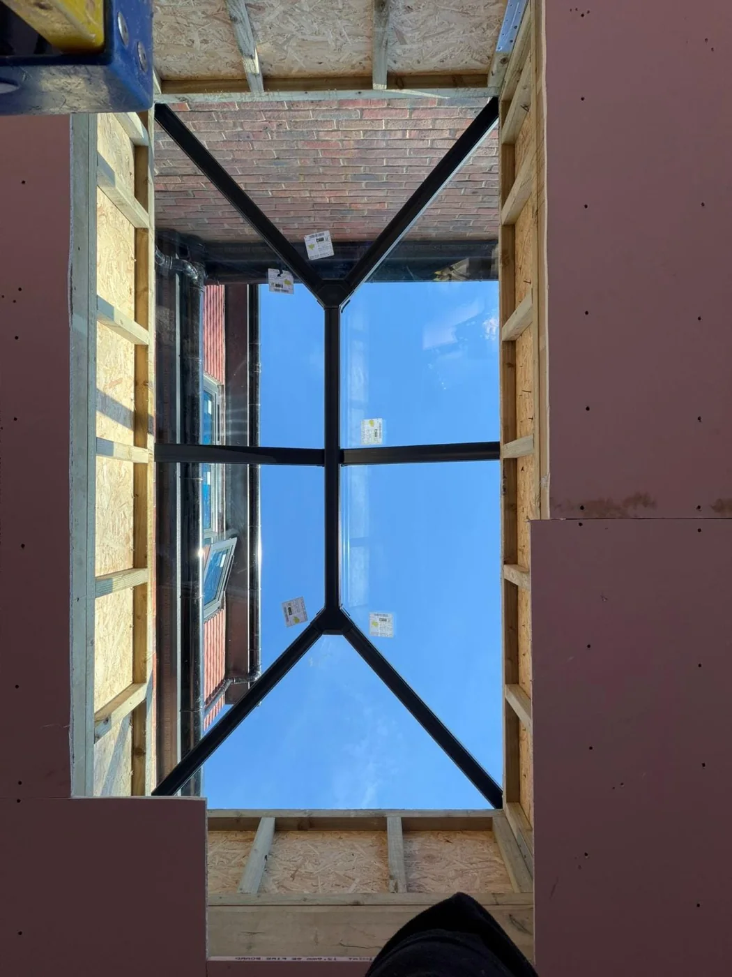 Pyramid rooflight viewed from inside a room under construction