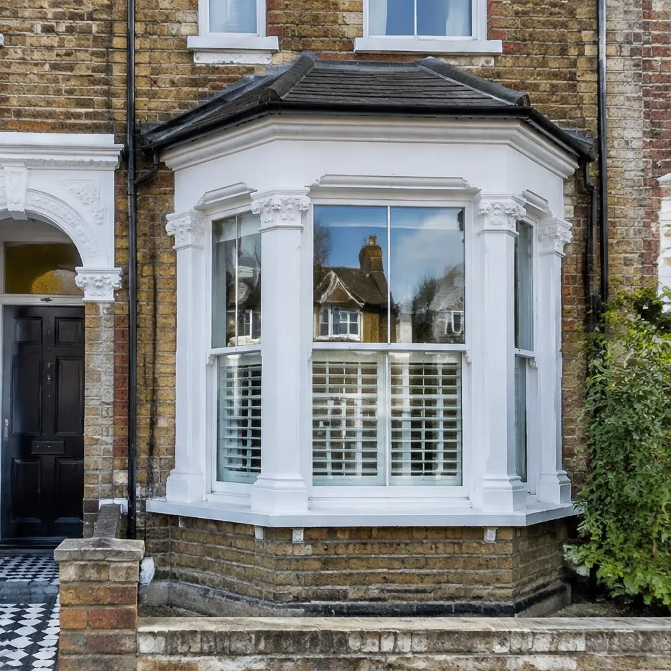 Bay windows installed at a traditional brick home in natural daylight