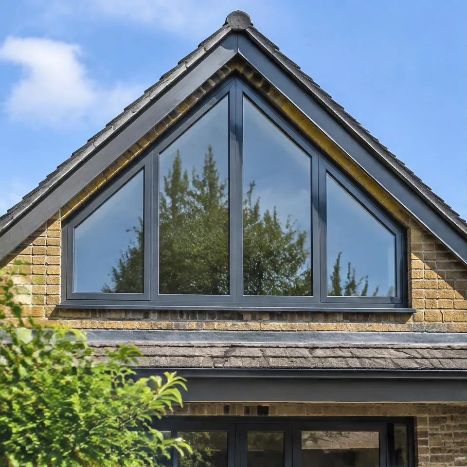Fixed and custom windows installed at a traditional brick home in natural daylight
