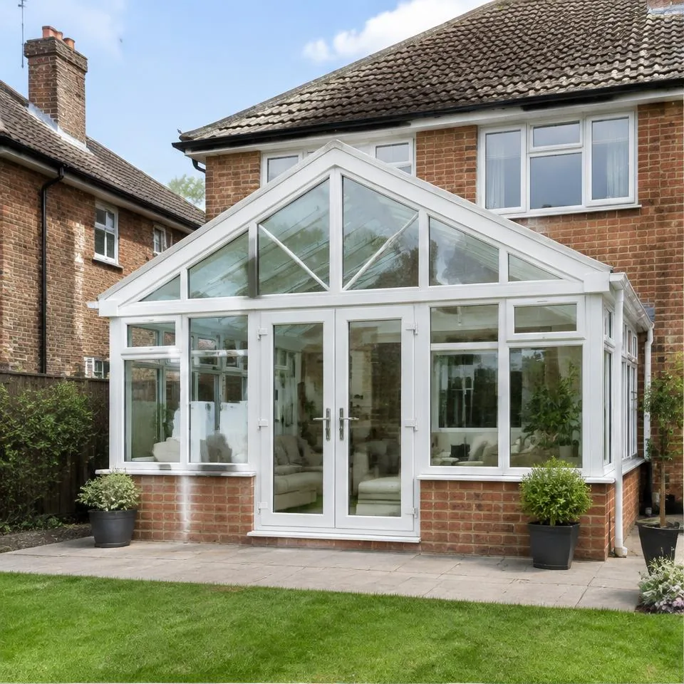 Regency conservatories installed at a traditional brick home in natural daylight