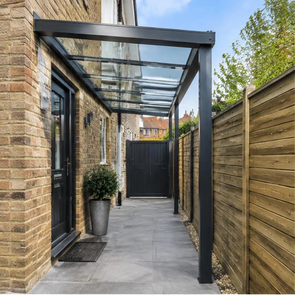 Simplicity canopies installed at a traditional brick home in natural daylight