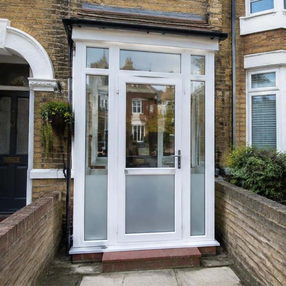 Porch and door enclosures installed at a traditional brick home in natural daylight