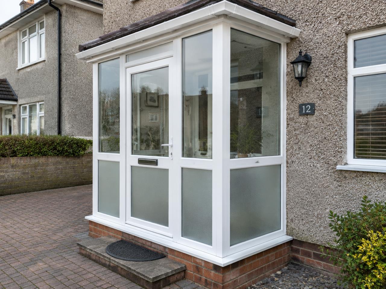 Enclosed entrance porches with glazing and entrance details